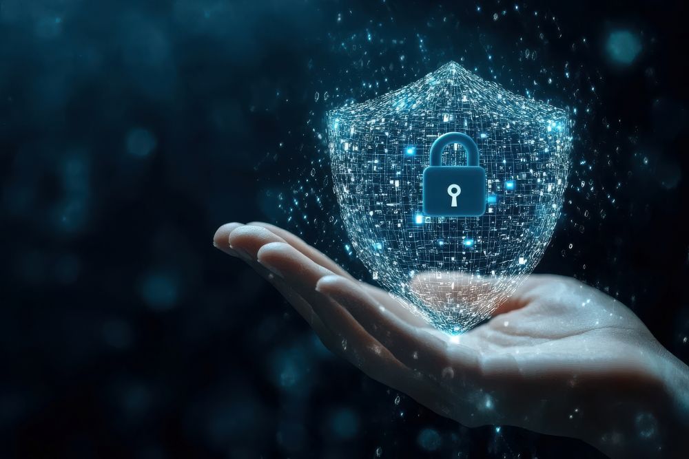A digital shield with a padlock hovering above a hand, symbolizing the critical importance of having a documented cybersecurity plan to protect clients and defend against liability in the event of a breach.